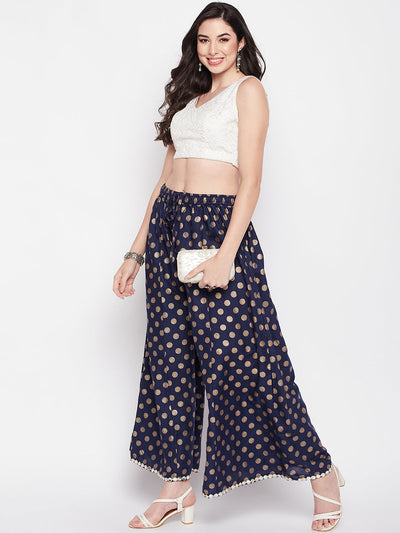 Navy blue polka dot sharara with embellished hem and elastic waistband.