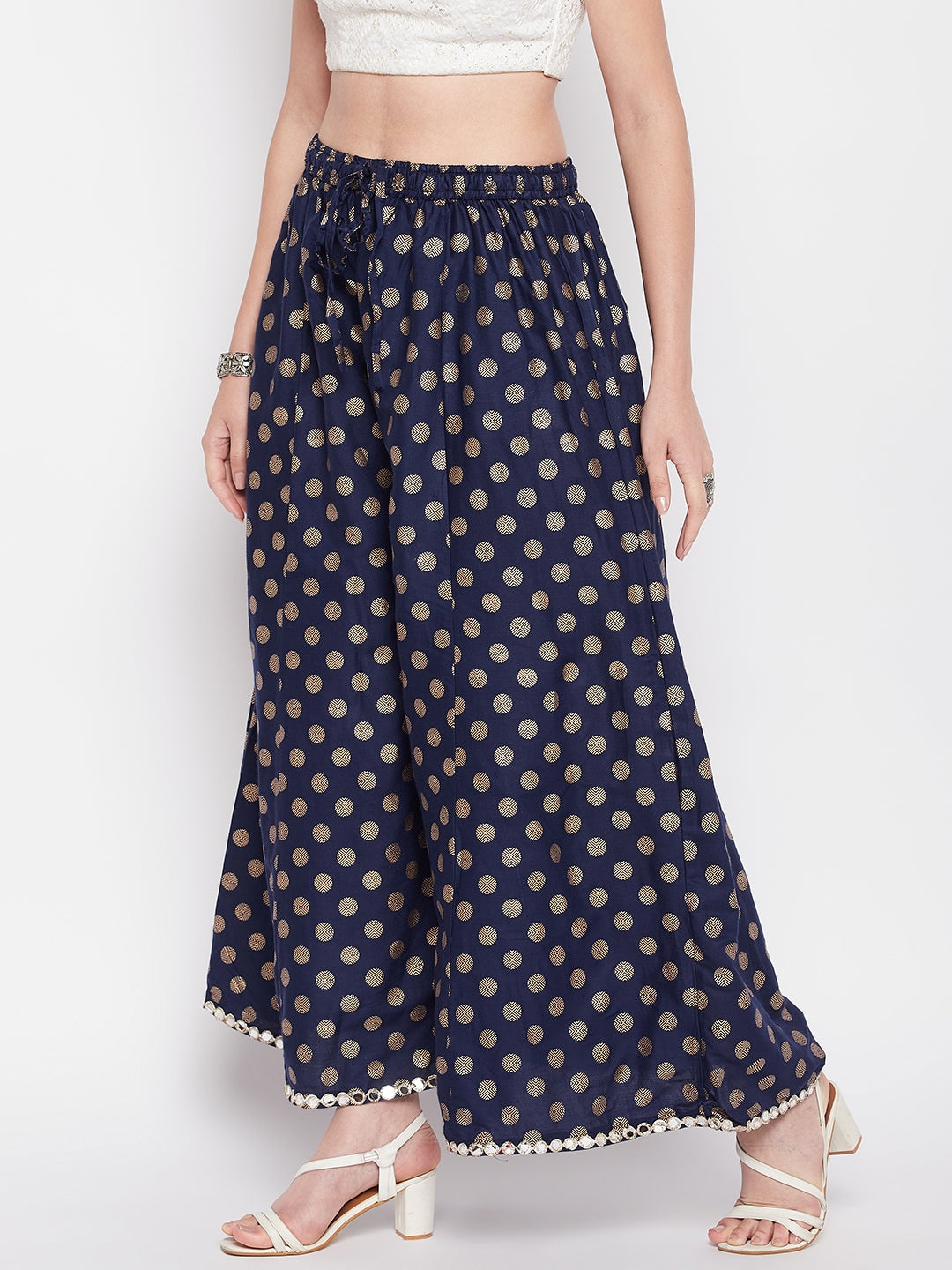 Navy blue polka dot rayon sharara with embellished hem and elasticated waistband.