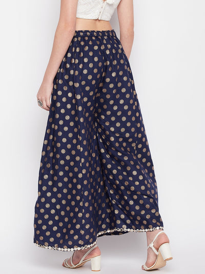 Navy blue polka dot rayon sharara with embellished hem and elasticated waistband.