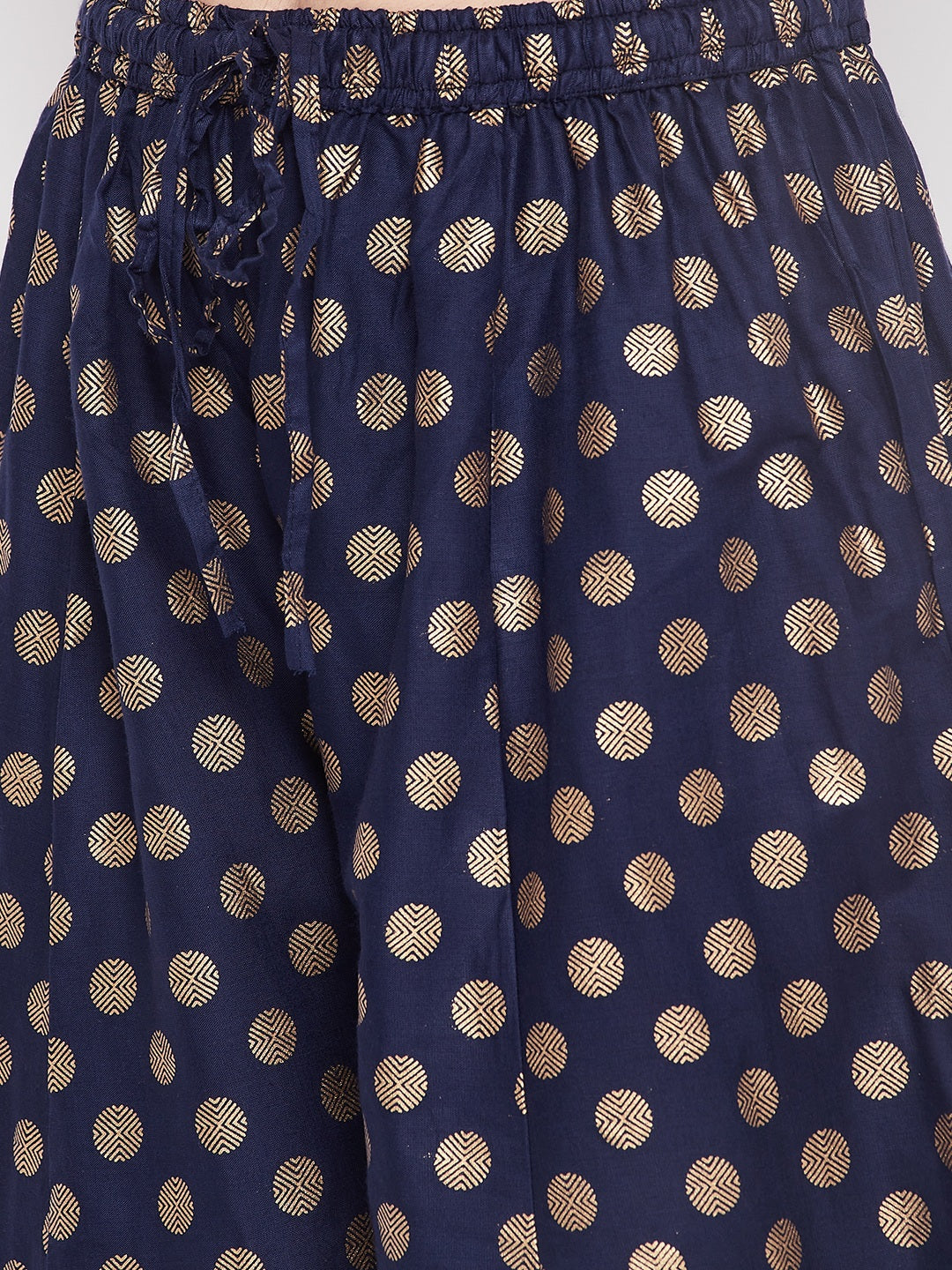 Navy blue polka dot rayon sharara with embellished hem and elasticated waistband.