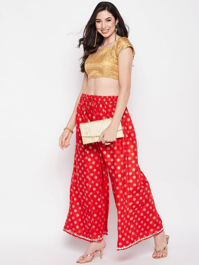 Red polka dot embellished hem rayon sharara with elasticated waistband and drawstring.