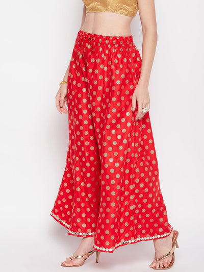 Red polka dot rayon sharara with embellished hem and elasticated waistband.