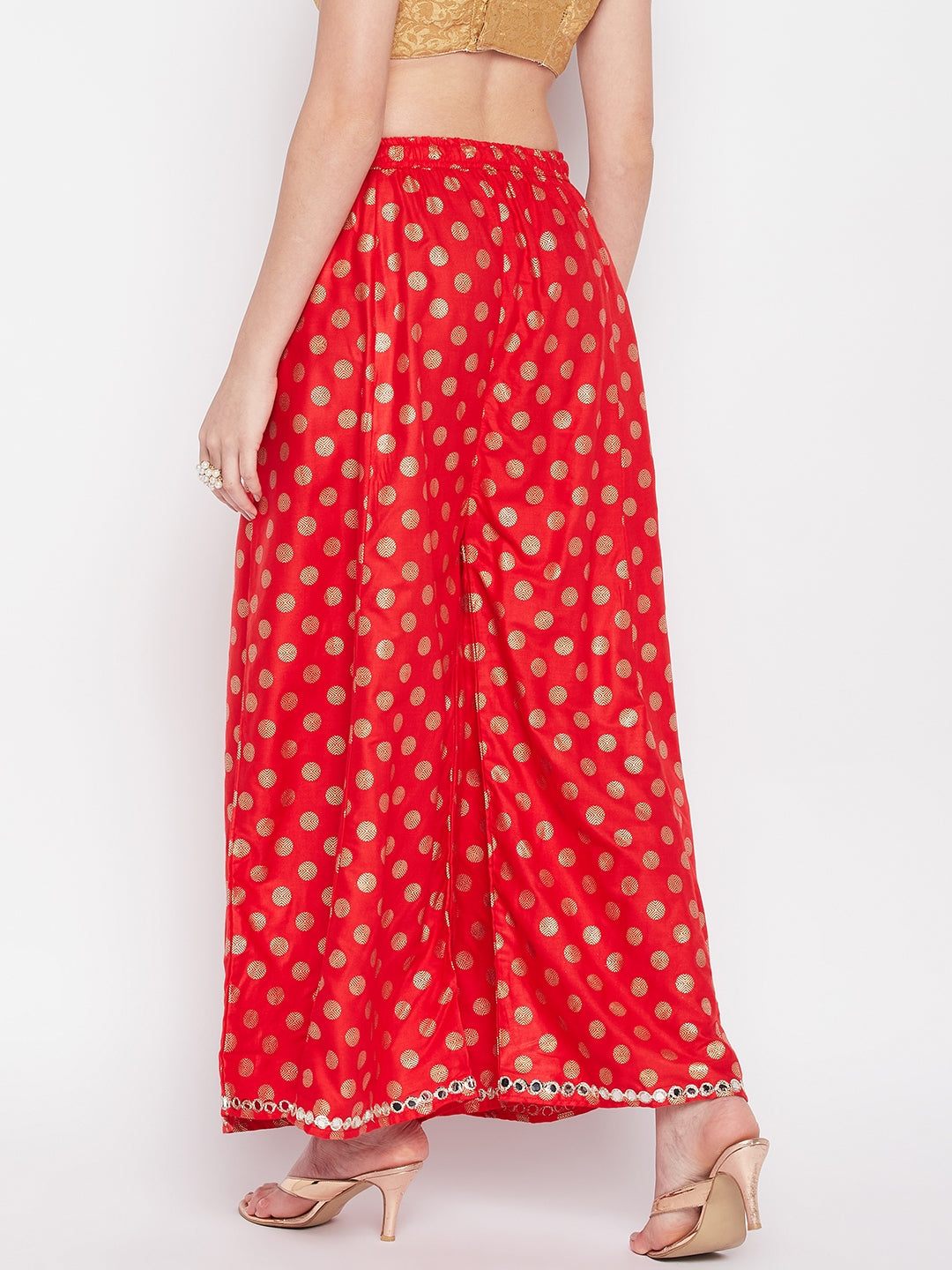 Red polka dot rayon sharara with embellished hem and elastic waistband.