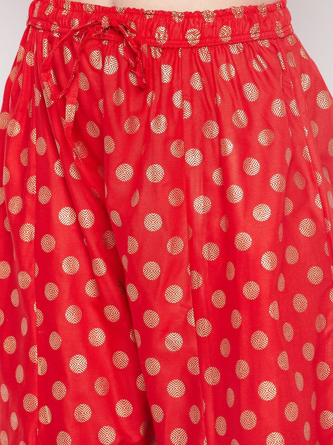 Red polka dot rayon sharara with embellished hem and elasticated drawstring waistband.