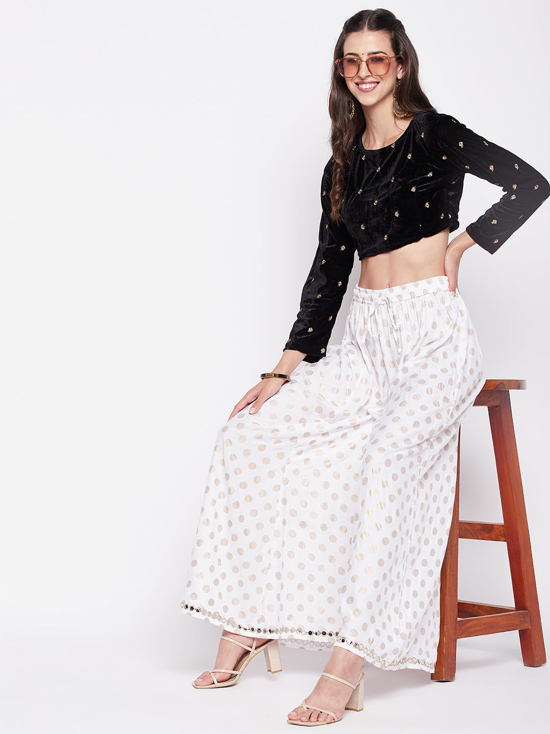 White polka dot rayon sharara with embellished hem and elasticated drawstring waistband.