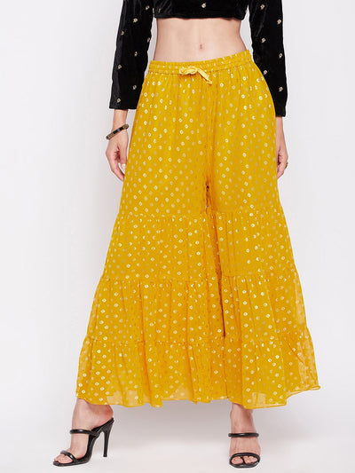 Mustard foil printed georgette gharara with flared hem and elasticated waistband.