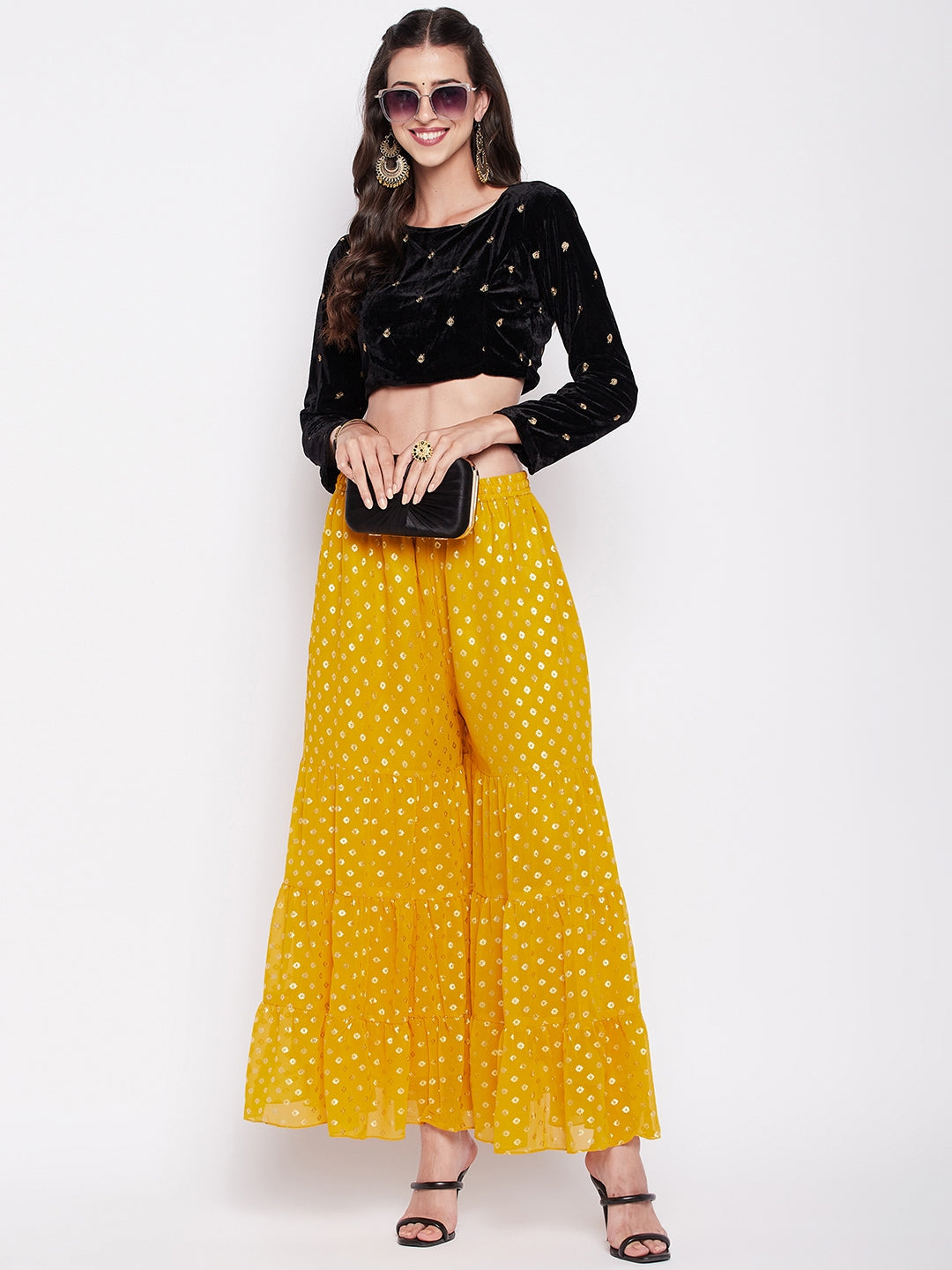 Mustard foil printed georgette gharara with flared hem and elasticated waistband.