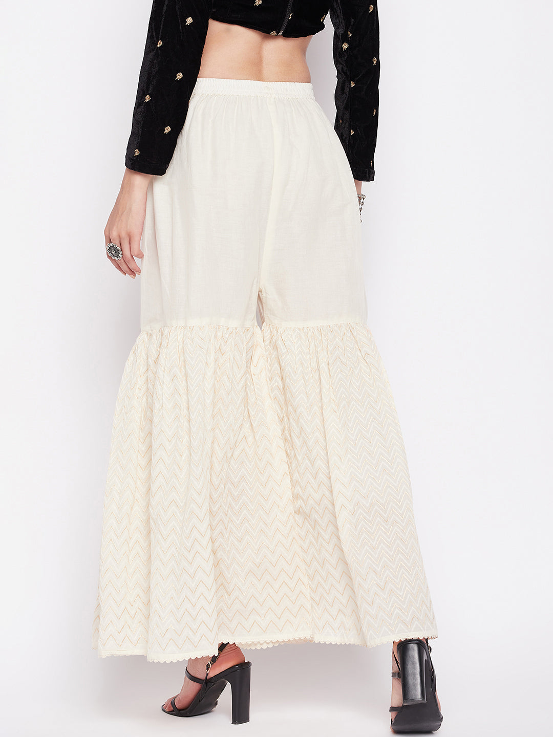 Off-white self-design cotton gharara with elasticated waistband and drawstring.