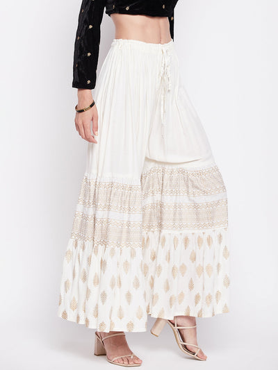 Off-White printed rayon flared gharara with elasticated waistband and drawstring.