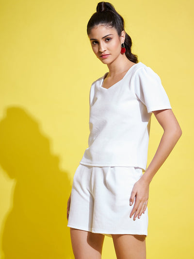 White solid regular fit top with V-neck and half sleeves.