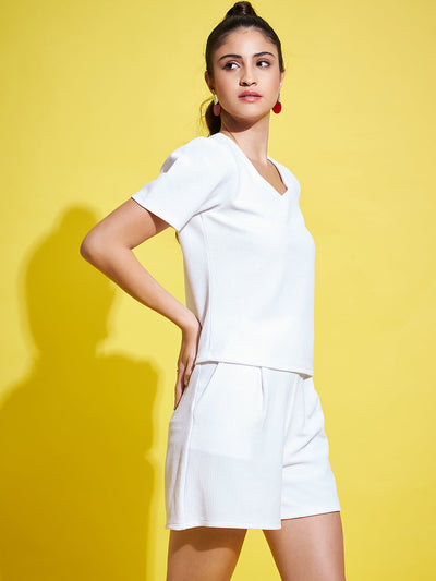 White solid regular fit top with V-neck and half sleeves.