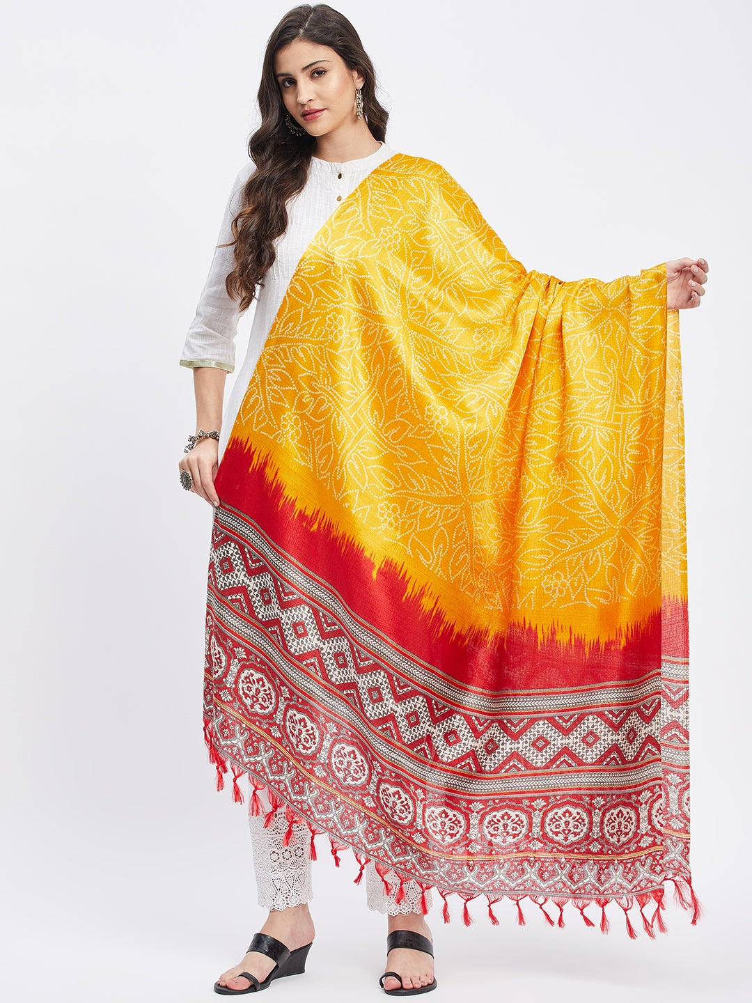 Mustard printed silk blend dupatta with tasselled border.