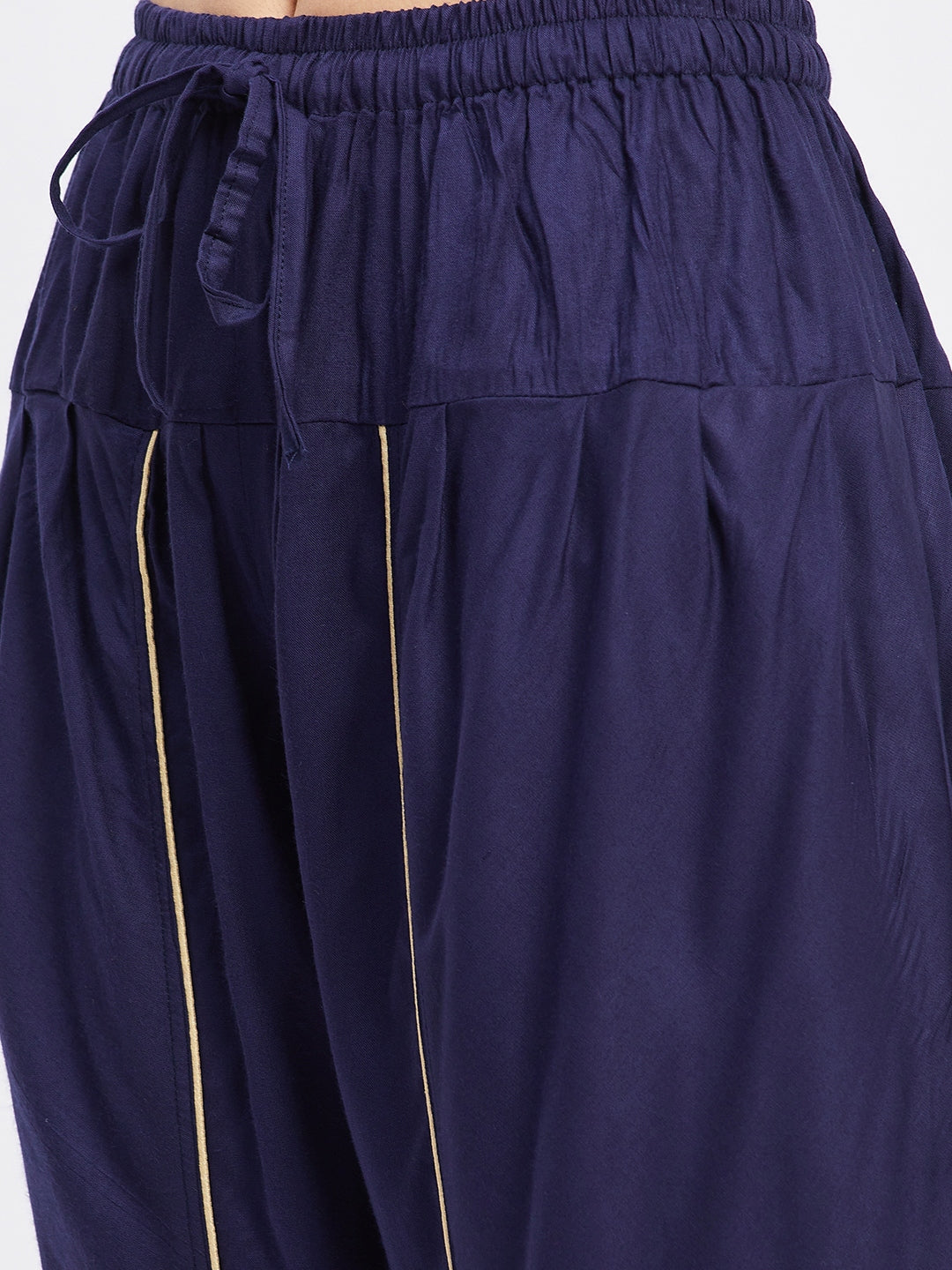 Navy blue solid rayon tulip pant with elastic waistband and side pocket.