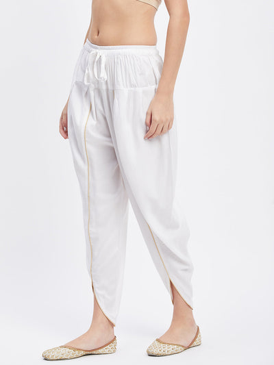 White solid rayon tulip pant with elastic waistband and drawstring.