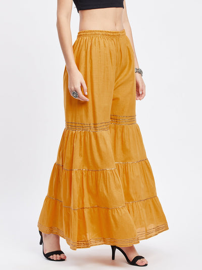 Mustard Gotta Patti cotton gharara with elasticated waistband and flared hem.