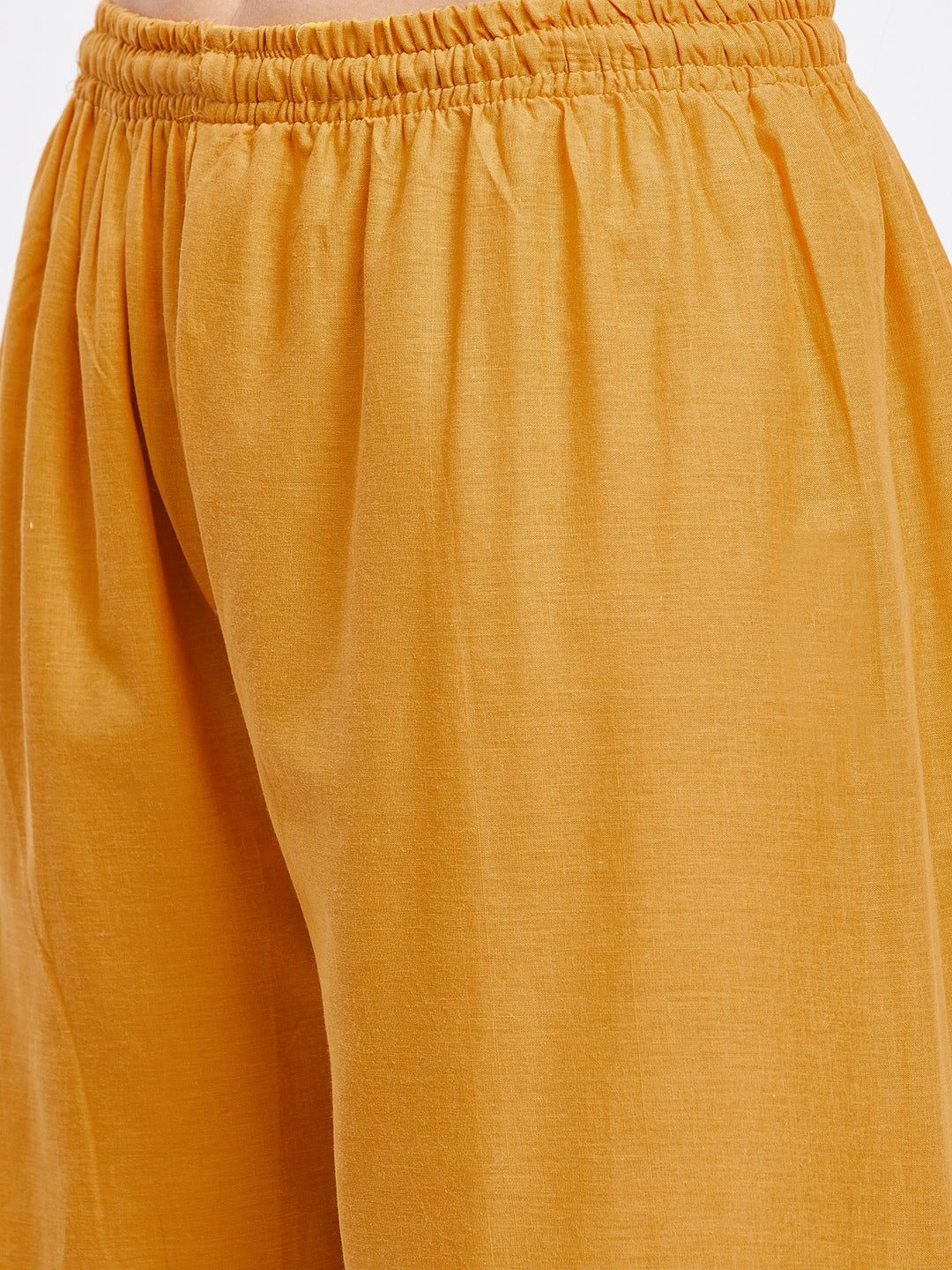 Mustard Gotta Patti cotton gharara with elasticated waistband and flared hem.