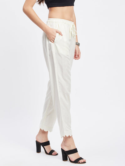 Off-White Solid Rayon Straight Palazzo with drawstring waistband and pocket.