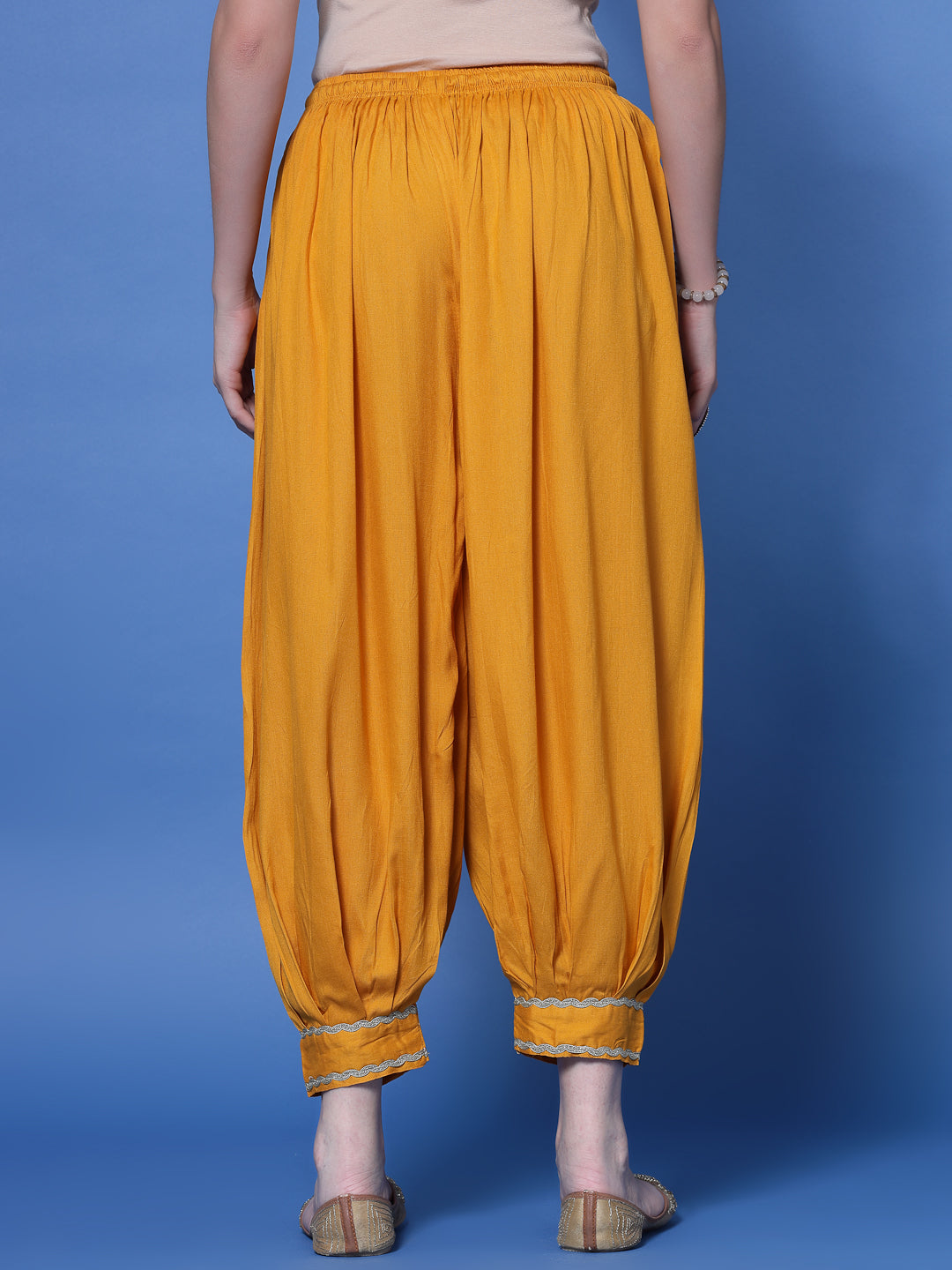 Mustard Afghani salwar with embellished hem and loose fit design.