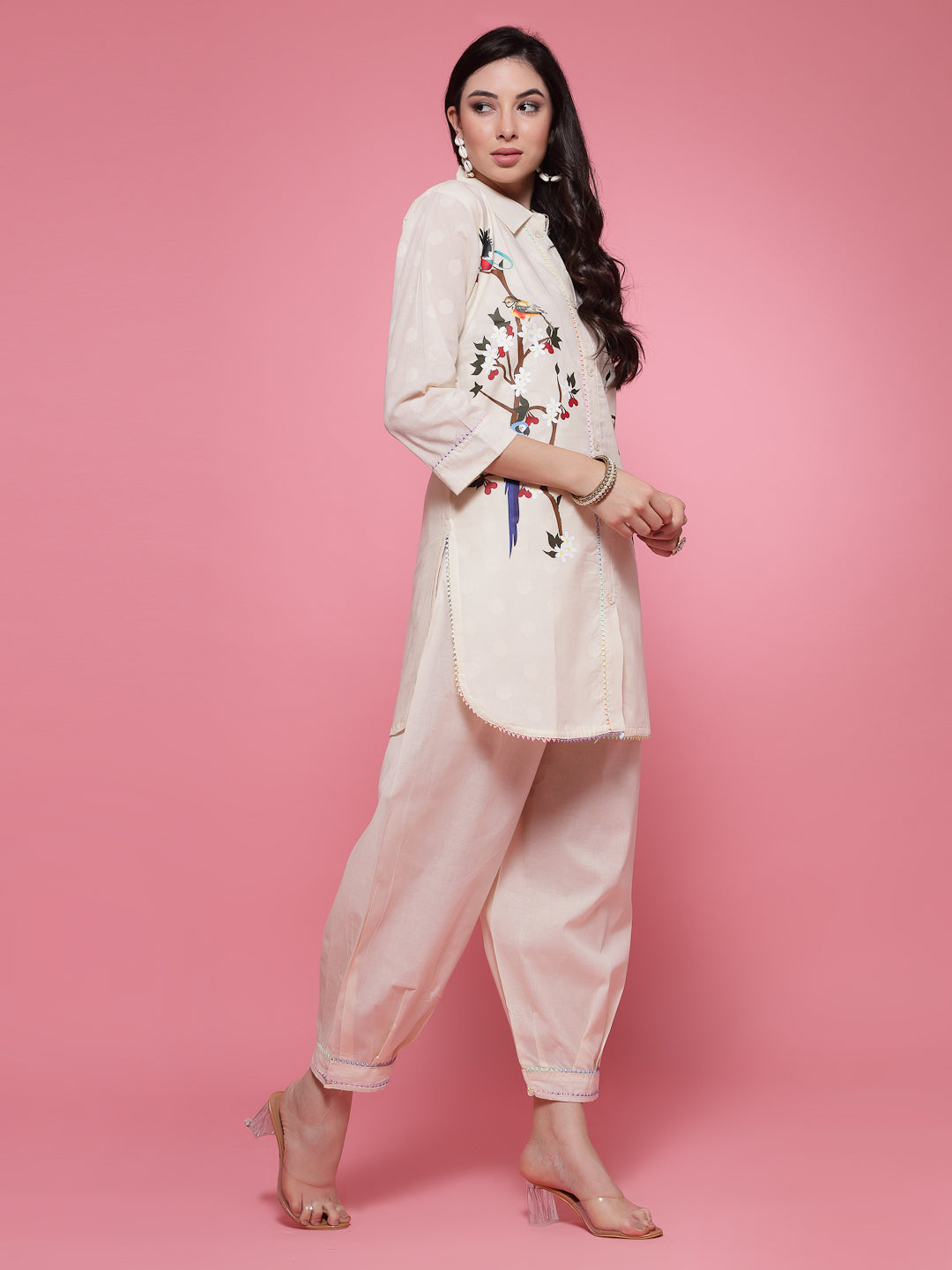 Off-White printed shirt with embroidery and Afghani salwar set featuring three-quarter sleeves and elasticated waistband.