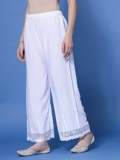 White self-design Chikankari straight palazzo with elasticated waistband and hem design.