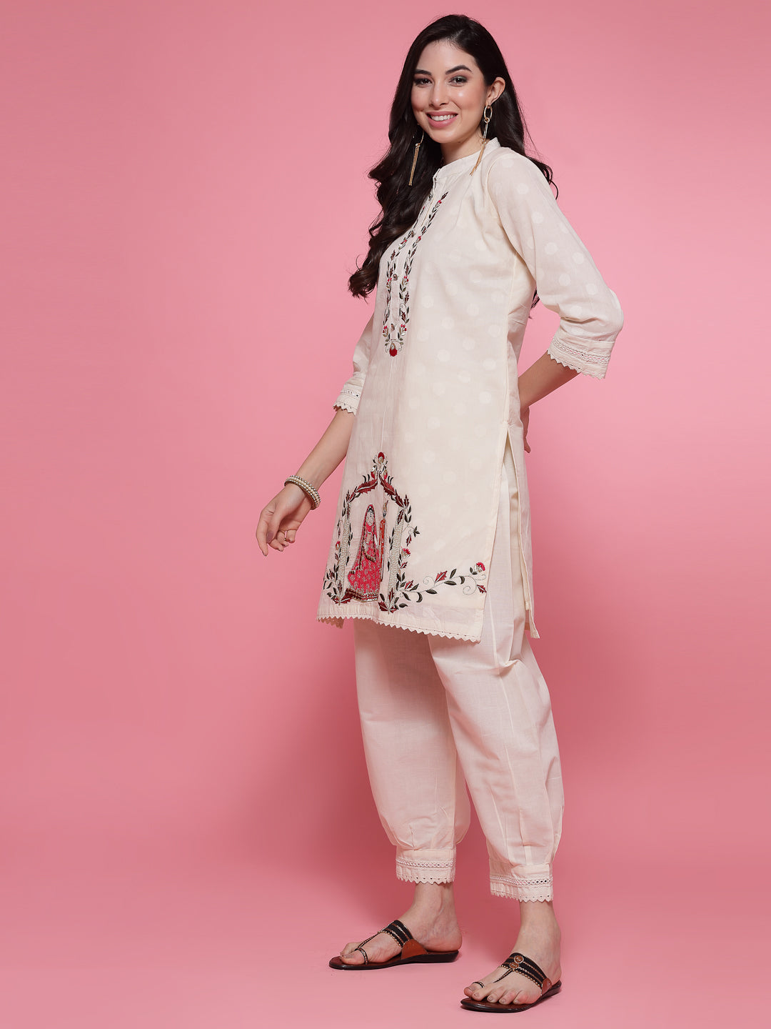 Off-white embroidered shirt with Afghani salwar co-ord set featuring detailed kurti and slip-on closure.