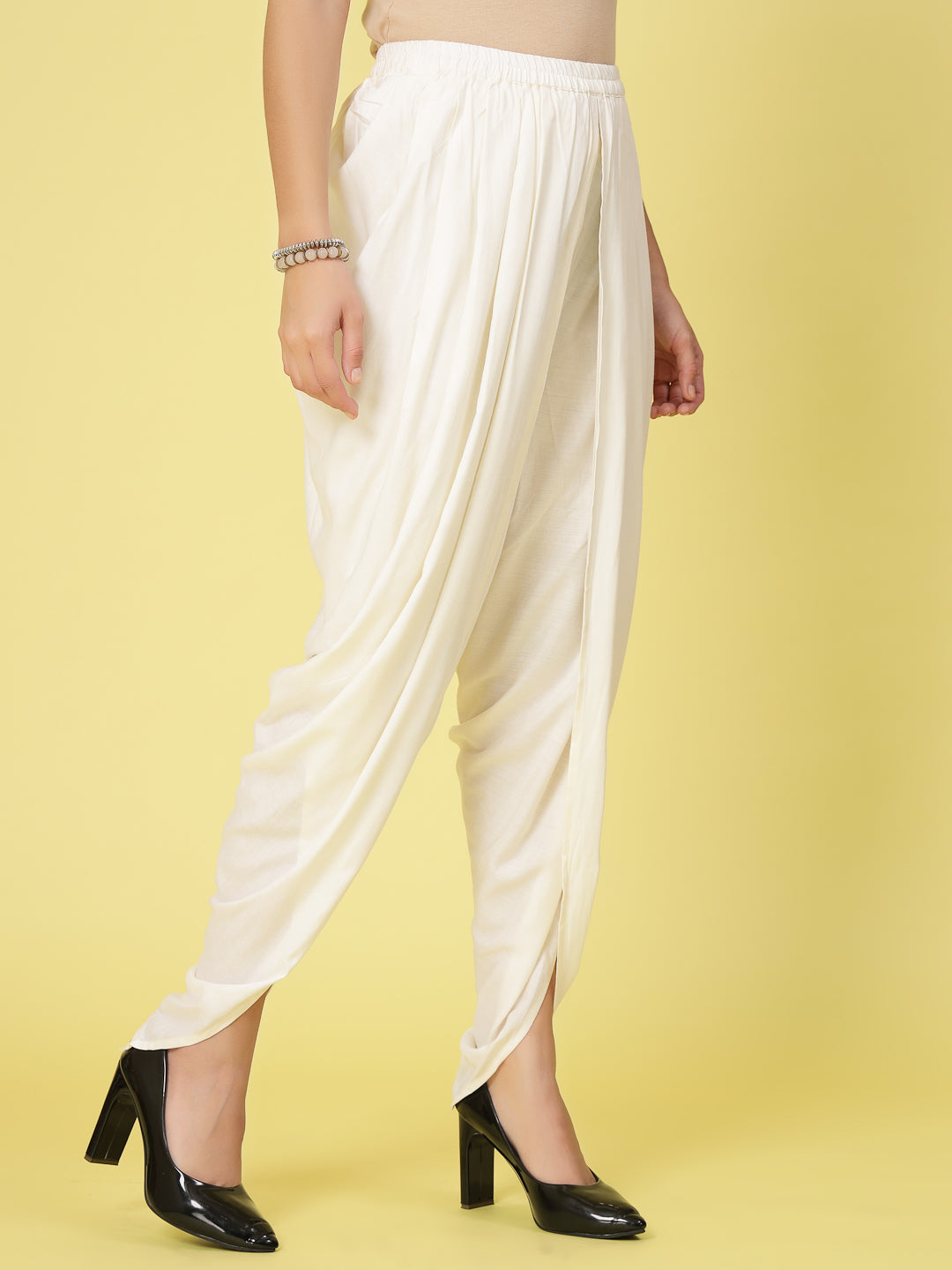 Women solid rayon dhoti salwar with pleated detail and elastic waistband.