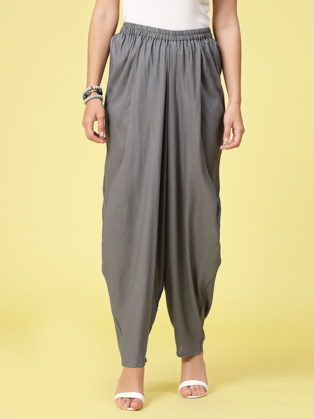 Women Solid Rayon Dhoti Salwar with elastic waistband and curved hemline.