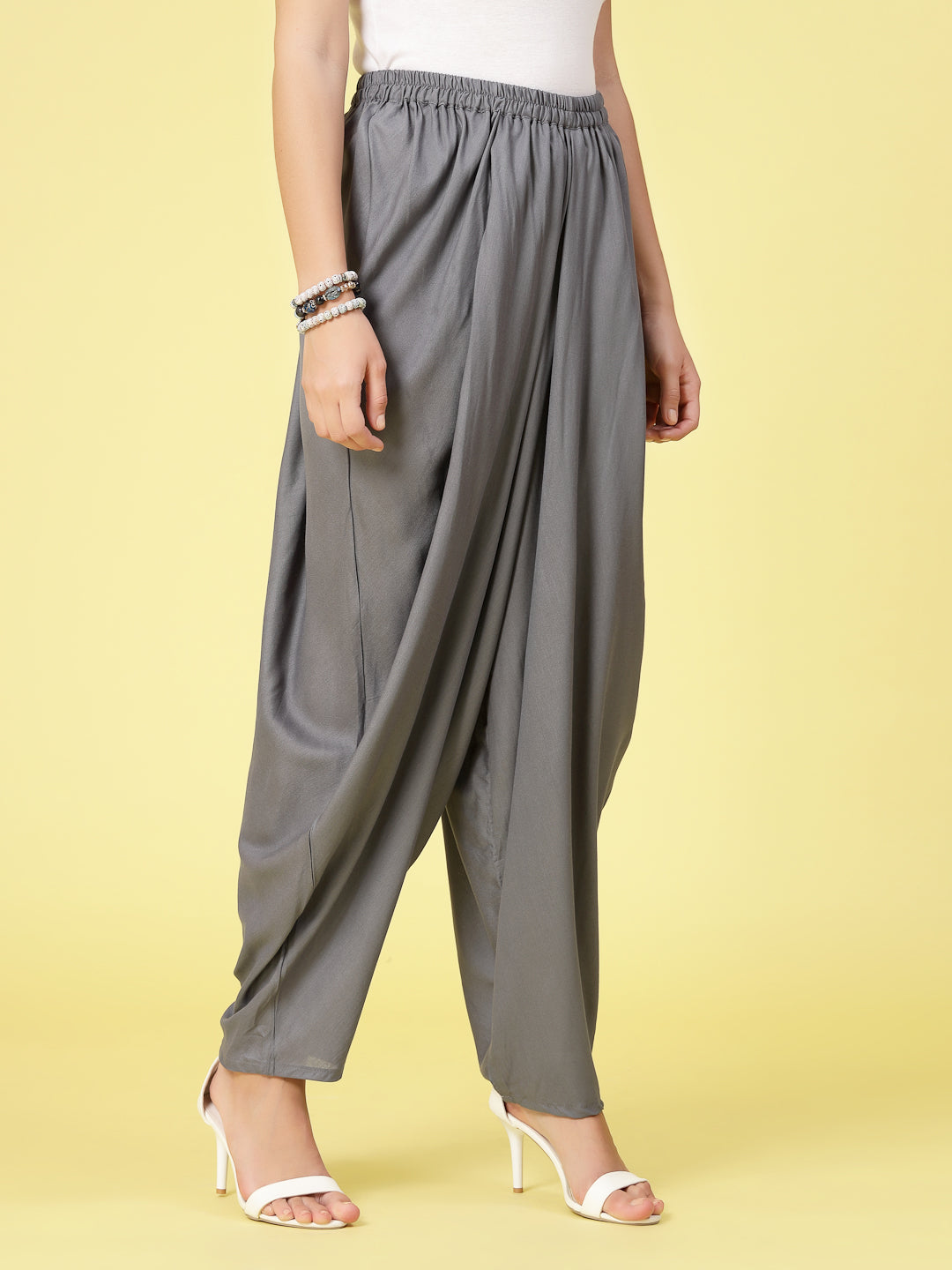 Women Solid Rayon Dhoti Salwar with elasticated waistband and curved hemline.