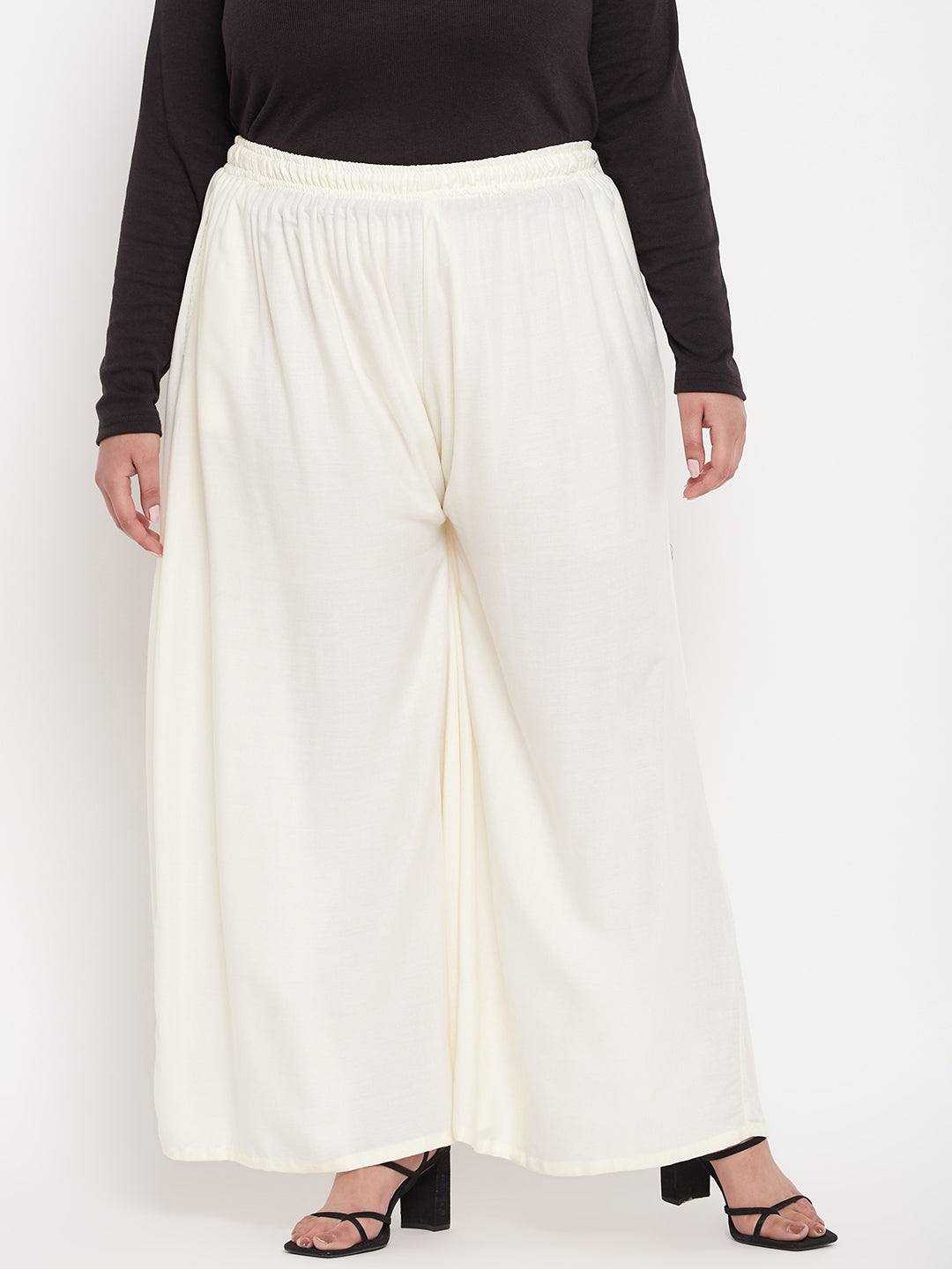 Off-White Solid Rayon Jumbo Sharara with elasticated waistband and drawstring.