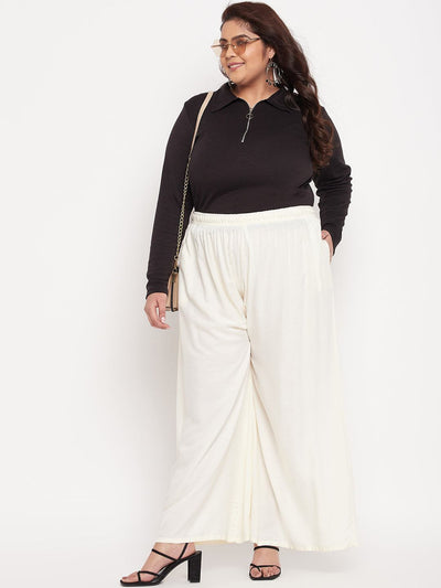 Off-White Solid Rayon Jumbo Sharara with elastic waistband and drawstring.