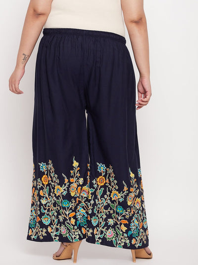 Navy blue printed rayon palazzo with elasticated waistband and floral design.