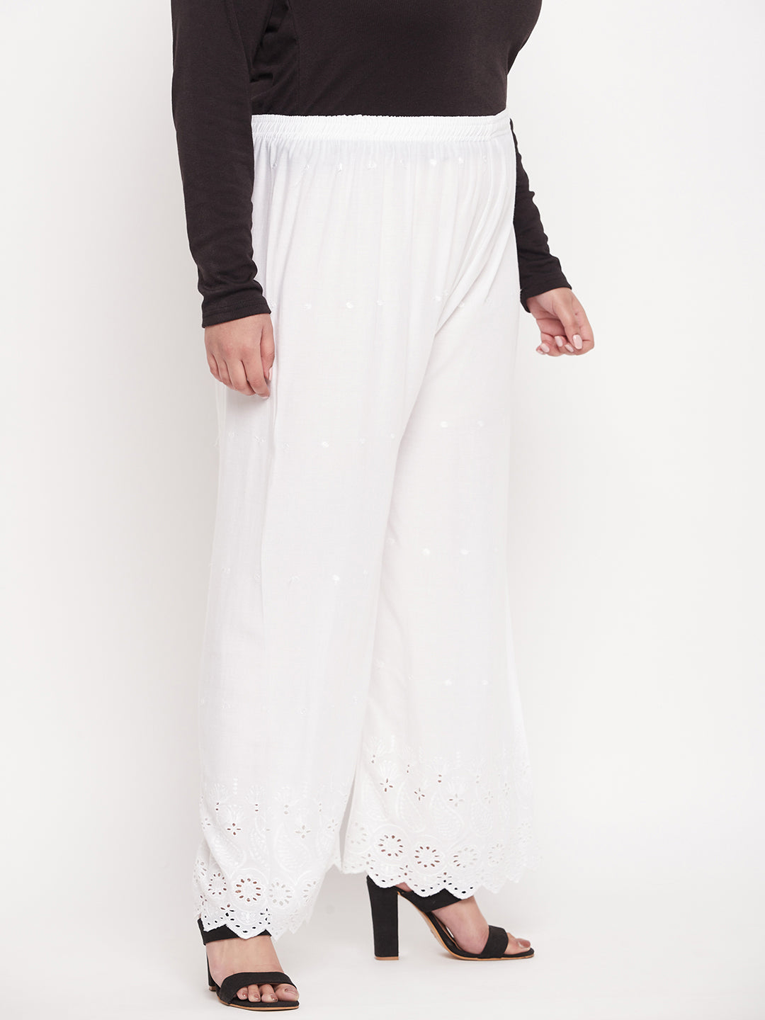 White embroidered rayon palazzo with Chikankari design and elasticated waistband.