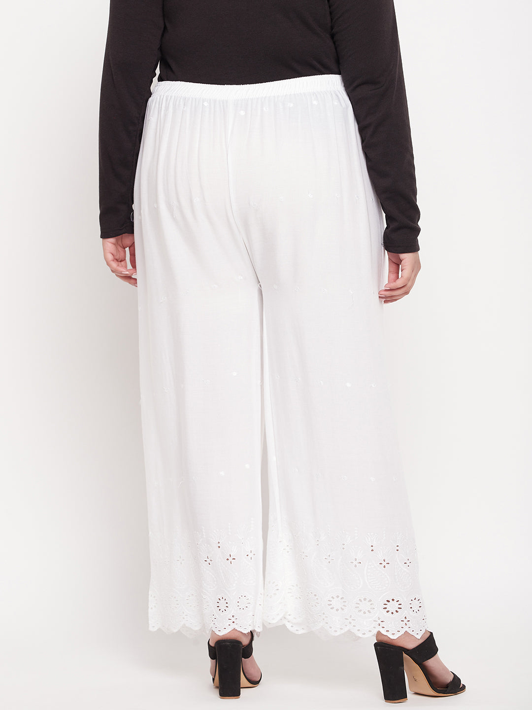 White embroidered rayon palazzo with elasticated waistband and drawstring.