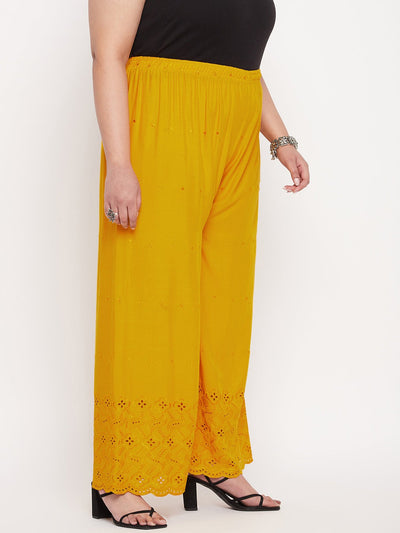 Mustard embroidered Chikankari rayon palazzo with elasticated waistband and drawstring.