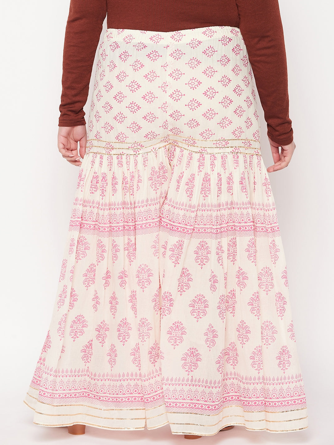 White and magenta printed cotton flared gharara with elasticated waistband and drawstring.