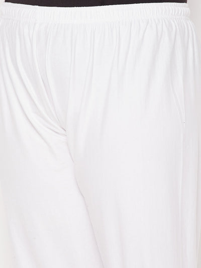 White solid lace palazzo with elasticated waistband and drawstring.