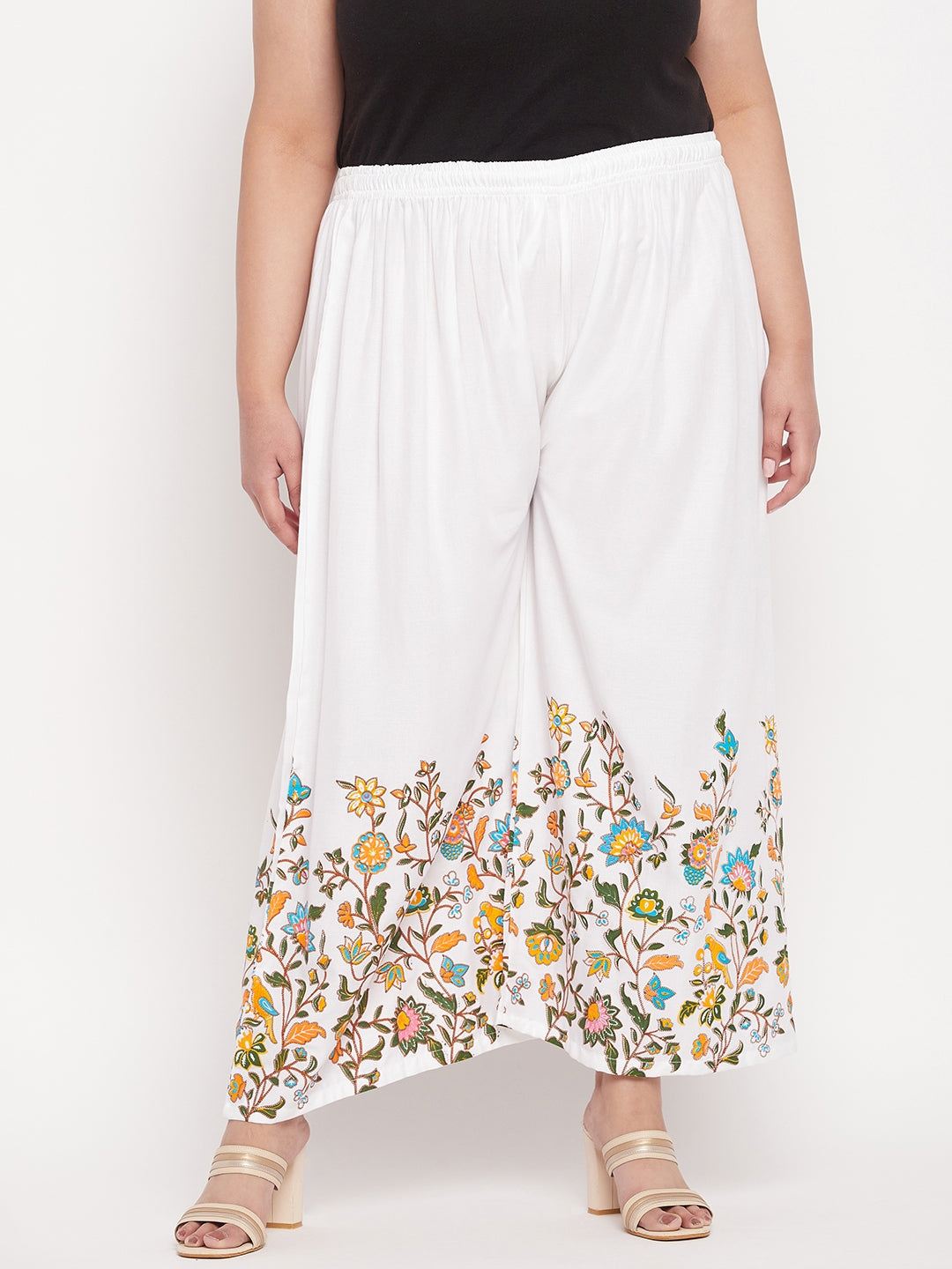 White printed rayon palazzo with floral design and elasticated waistband.