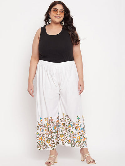 White printed rayon palazzo with floral design and elastic waistband.