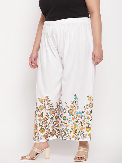 White printed rayon palazzo with floral design and elasticated waistband.