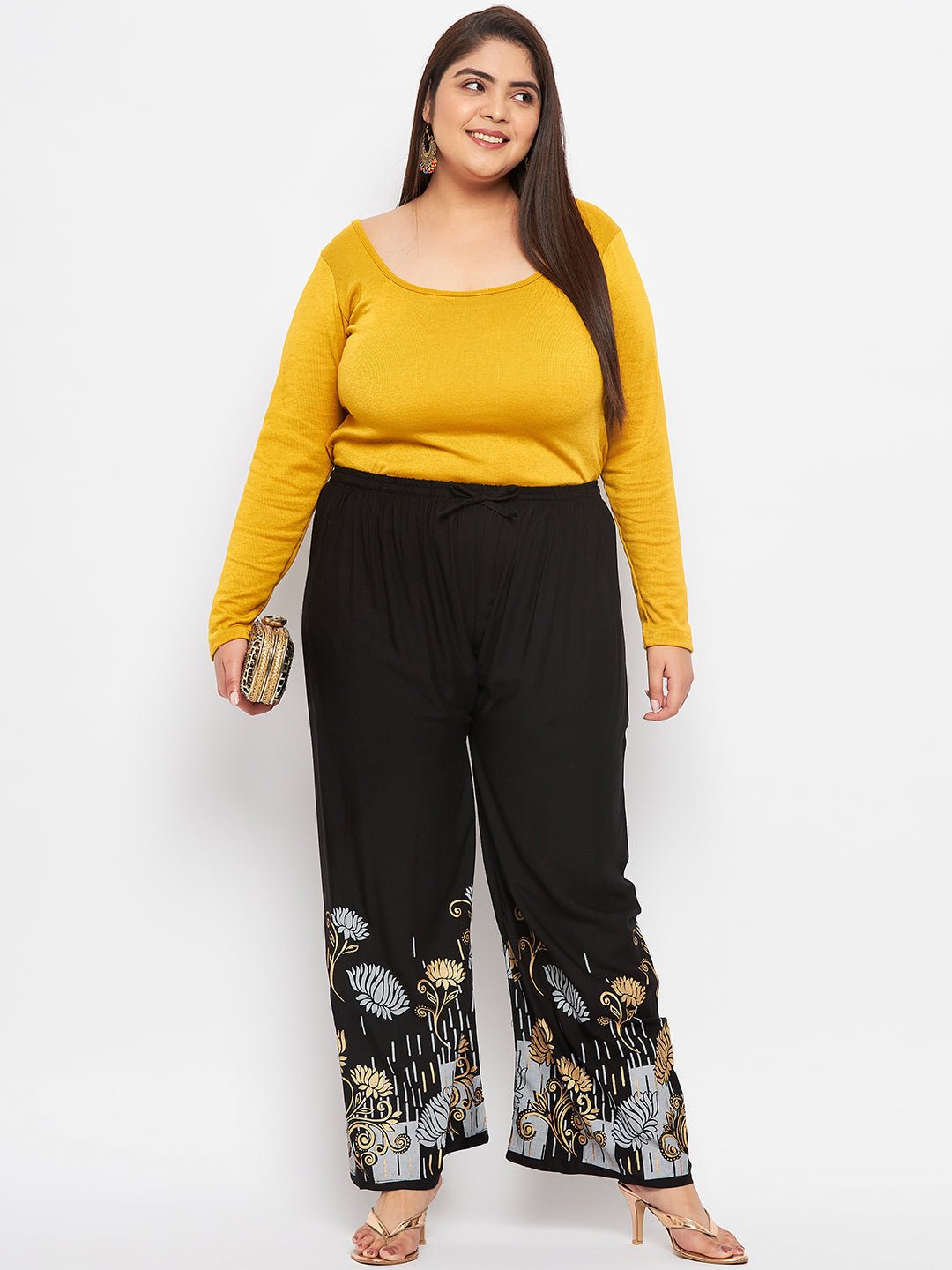 Black printed rayon straight palazzo with solid hem and elasticated waistband.
