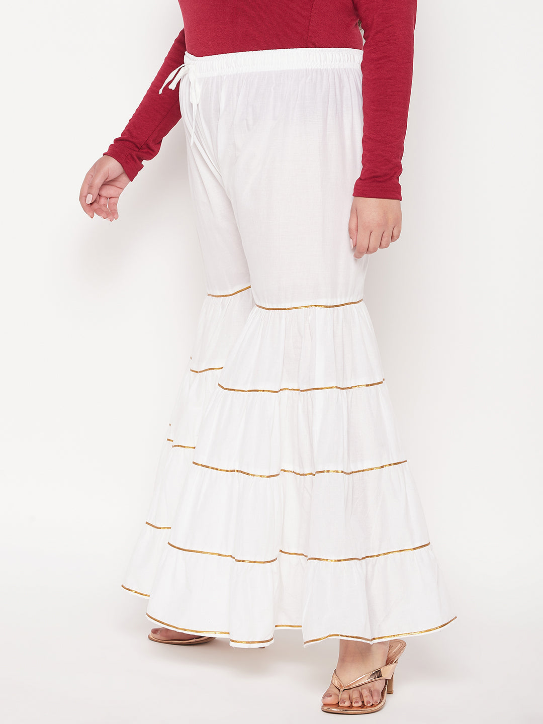 White solid cotton flared Gharara with Gotta Patti, elastic waistband, and drawstring.