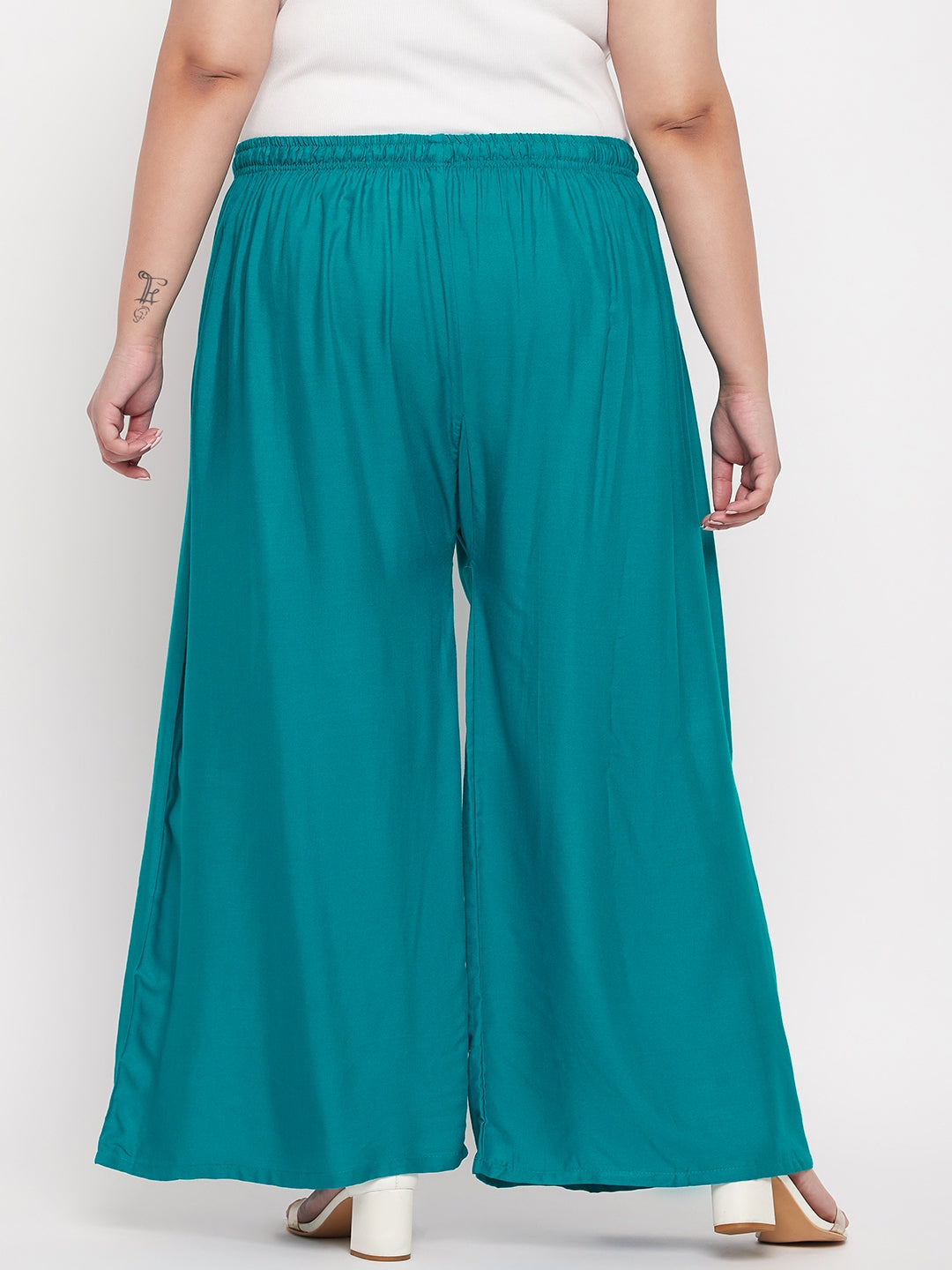 Rama green solid rayon palazzo with elasticated waistband and drawstring.