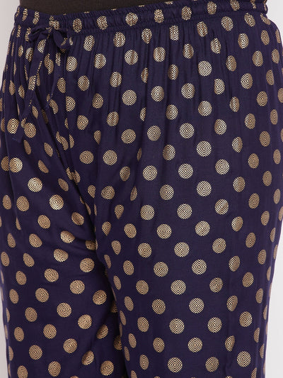 Navy blue polka dot printed palazzo with elasticated waistband and drawstring.