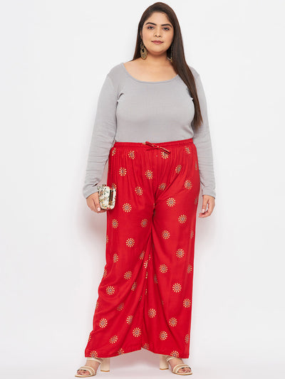 Red printed rayon palazzo with elasticated waistband and drawstring.