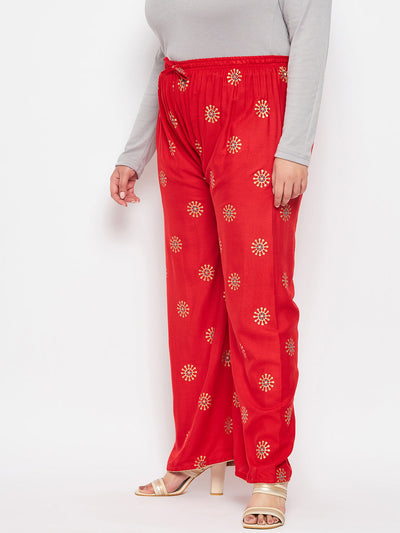 Red printed rayon palazzo with elasticated waistband and drawstring.