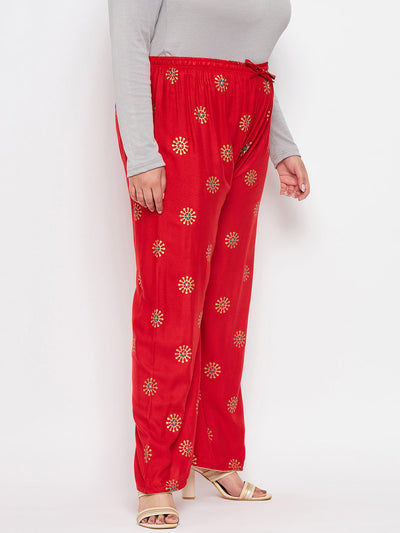 Red printed rayon palazzo with elasticated waistband and drawstring.