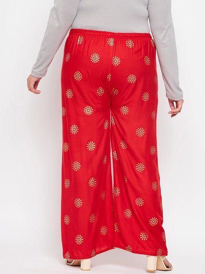 Red printed rayon palazzo with elasticated waistband and drawstring.