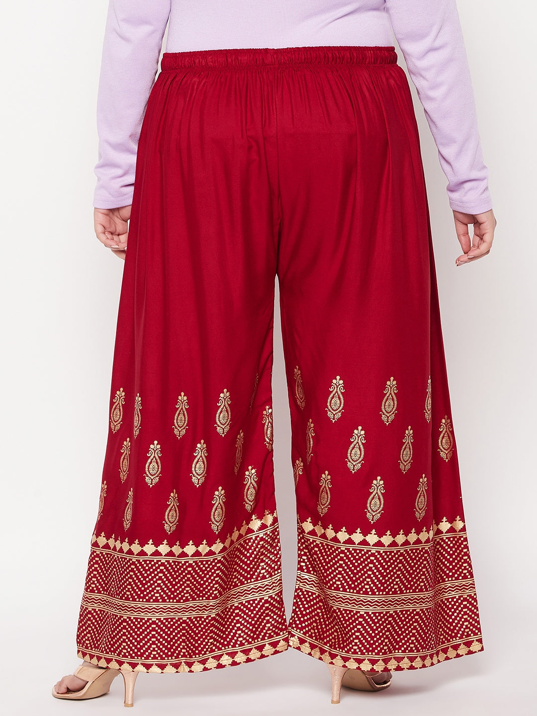 Maroon printed wide leg rayon palazzo with elastic waistband and drawstring.