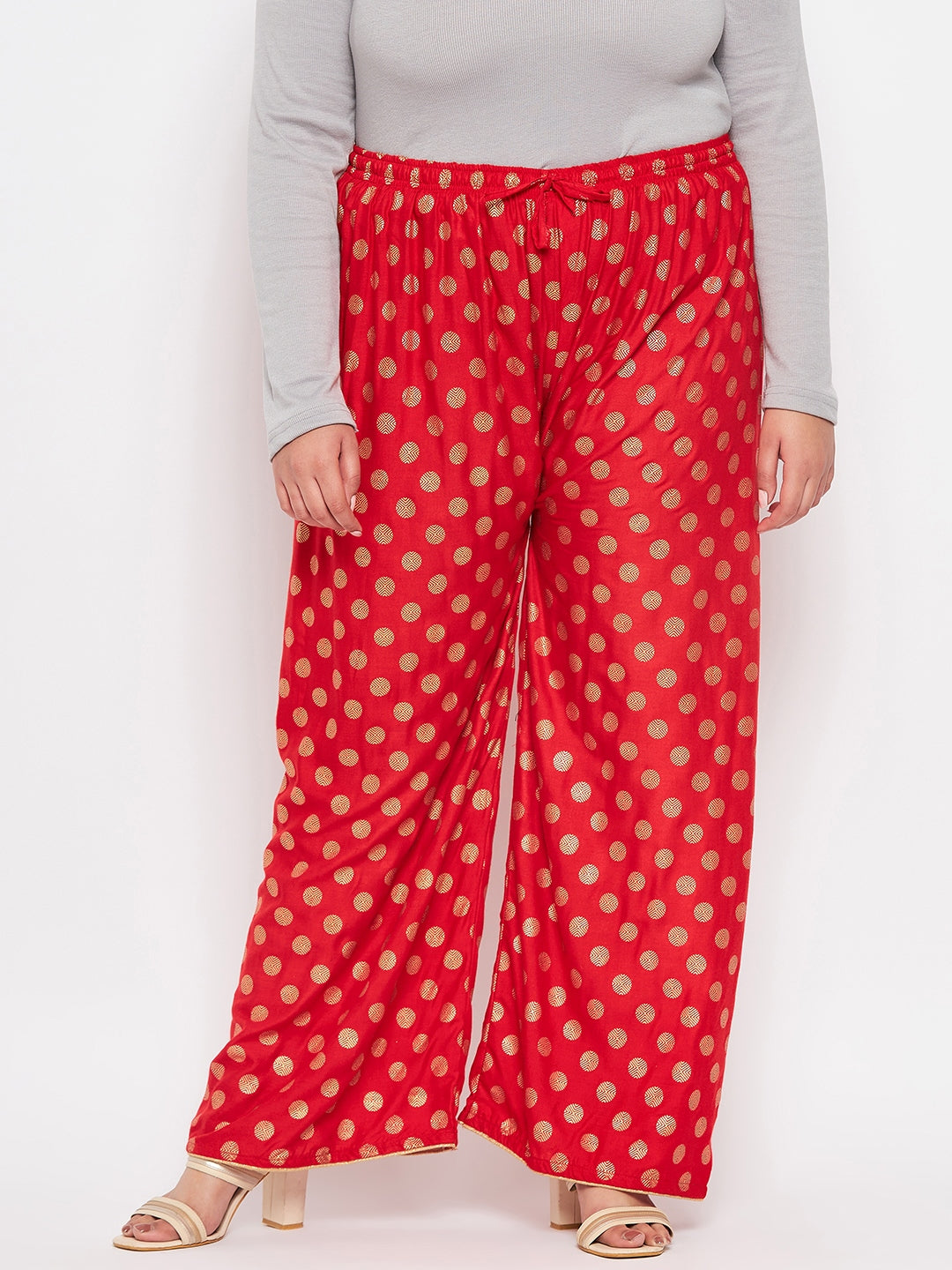 Red Polka Dot Printed Palazzo with elastic waistband and drawstring.