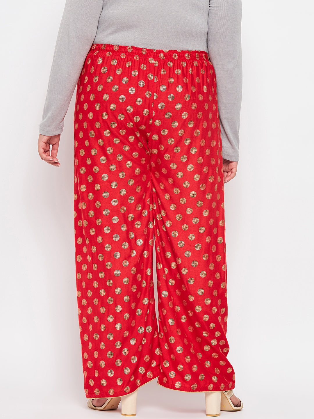 Red polka dot printed palazzo with elasticated waistband and drawstring.